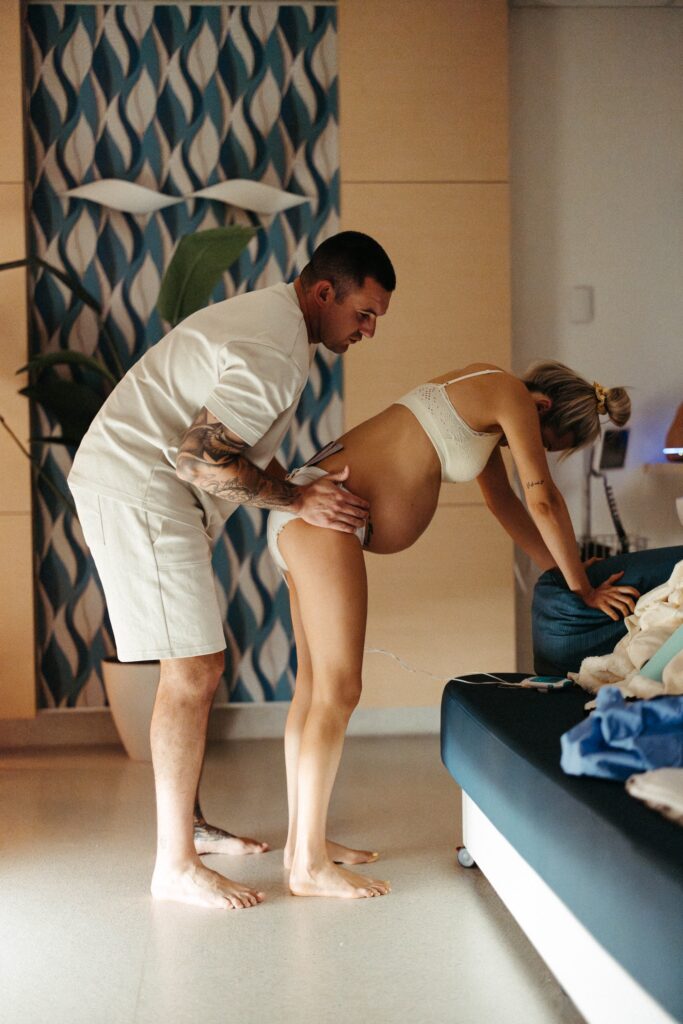 A husband supporting her wife through labour