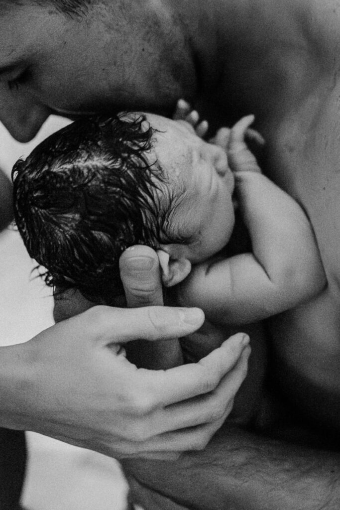 A father holding his baby for the first time