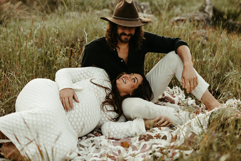 A maternity photoshoot with an expecting mother and father